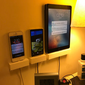 Vägghållare för surfplattor och telefoner