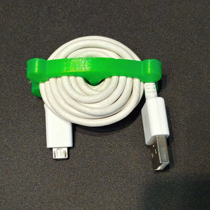 Kompakt USB-kabelhållare och -vinda