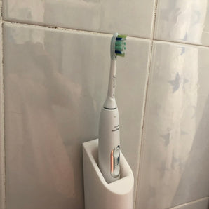 Väggmonterad Philips Sonicare tandborstehållare med laddare