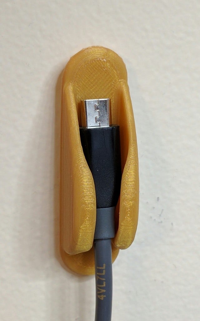 Praktisk vägghållare för kablar och USB-kablar