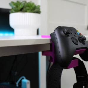 Universellt klämfäste för handkontroll och headset