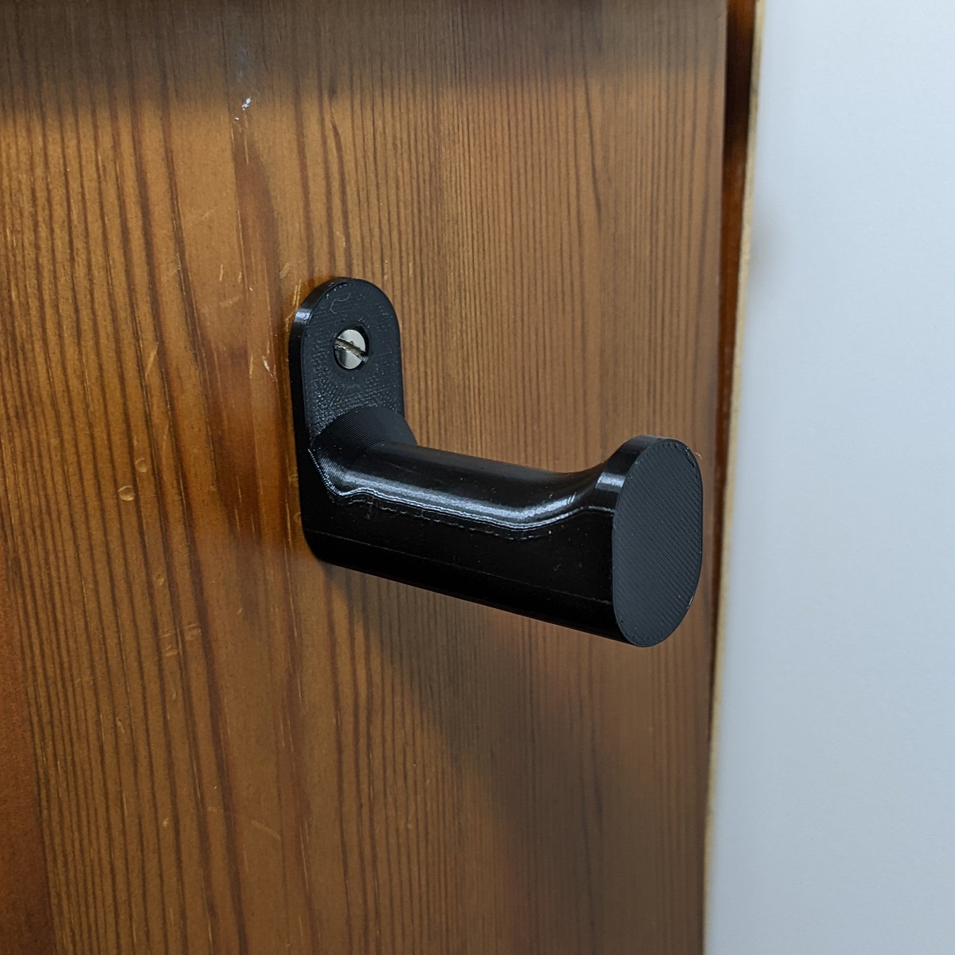 Väggmonterad hörlurshållare – Kompakt design