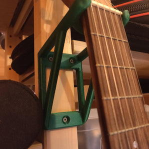 Väggmonterad gitarrhängare för små och barngitarrer