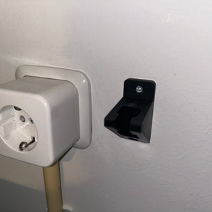 Väggmonterad nätsladdshållare
