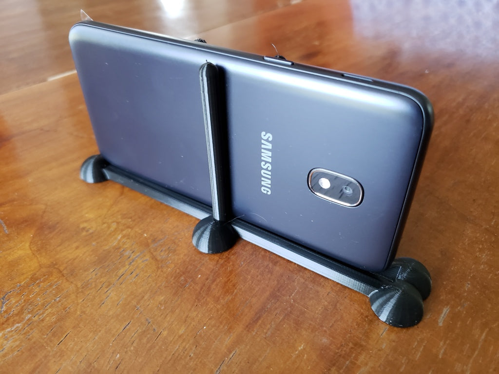 Minimalistiskt telefonställ för Samsung J3 Orbit med sfäriska ben