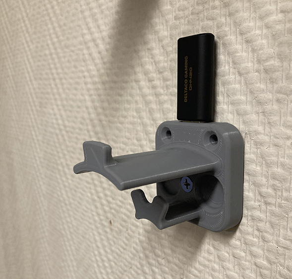 Hörlurshållare med kabelhållare och USB-dongelutrymme