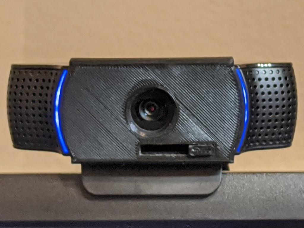 Skjut för att öppna webbkamerahöljet för Logitech c922