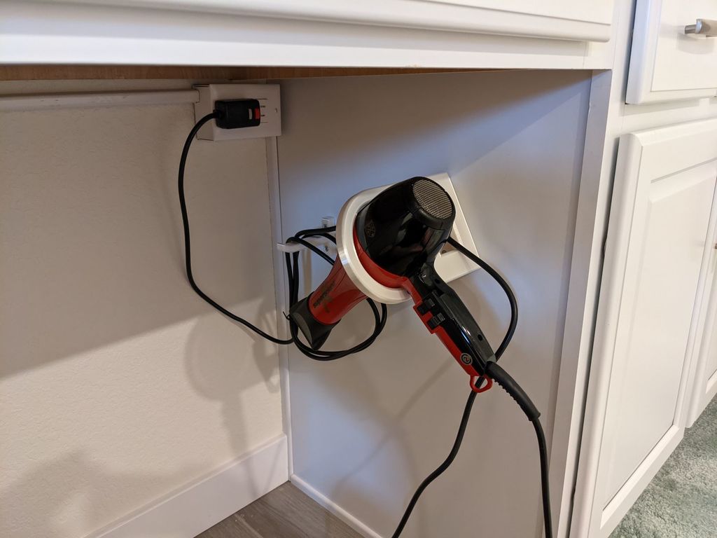 Sidomonterad hårtorkhållare och kabelkrok