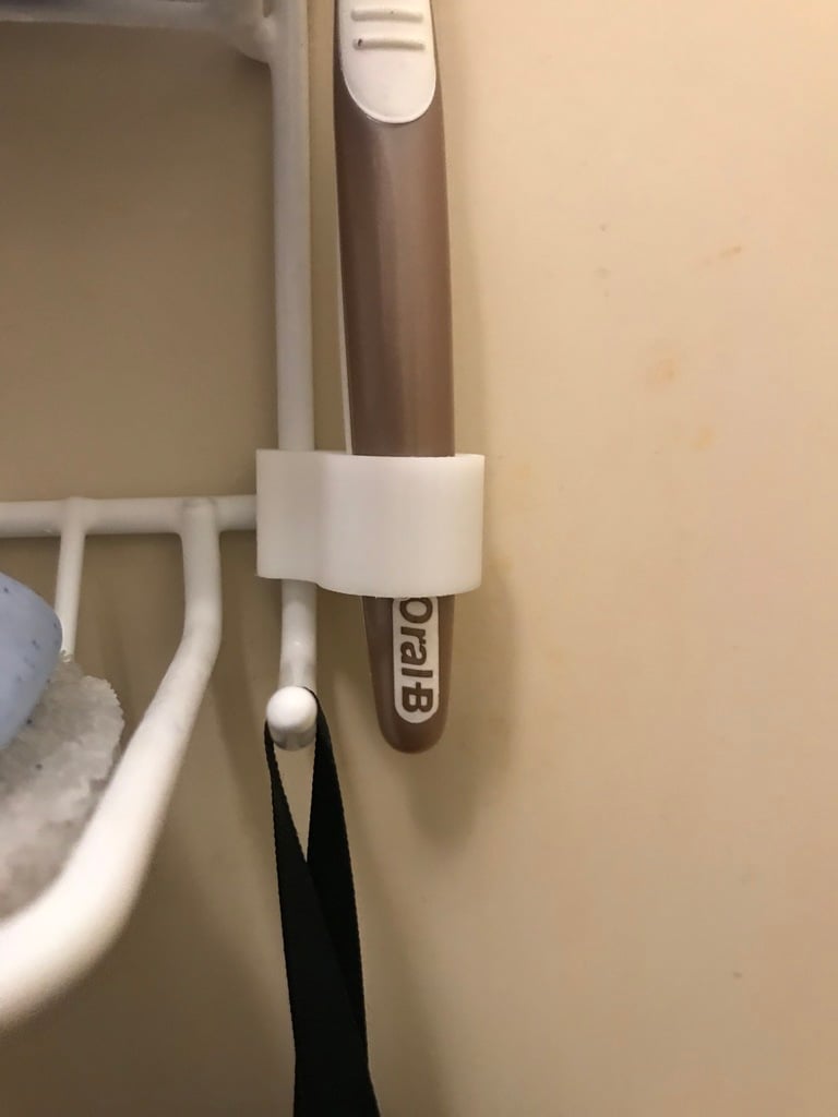 Tandborsthållare för trådram duschhylla