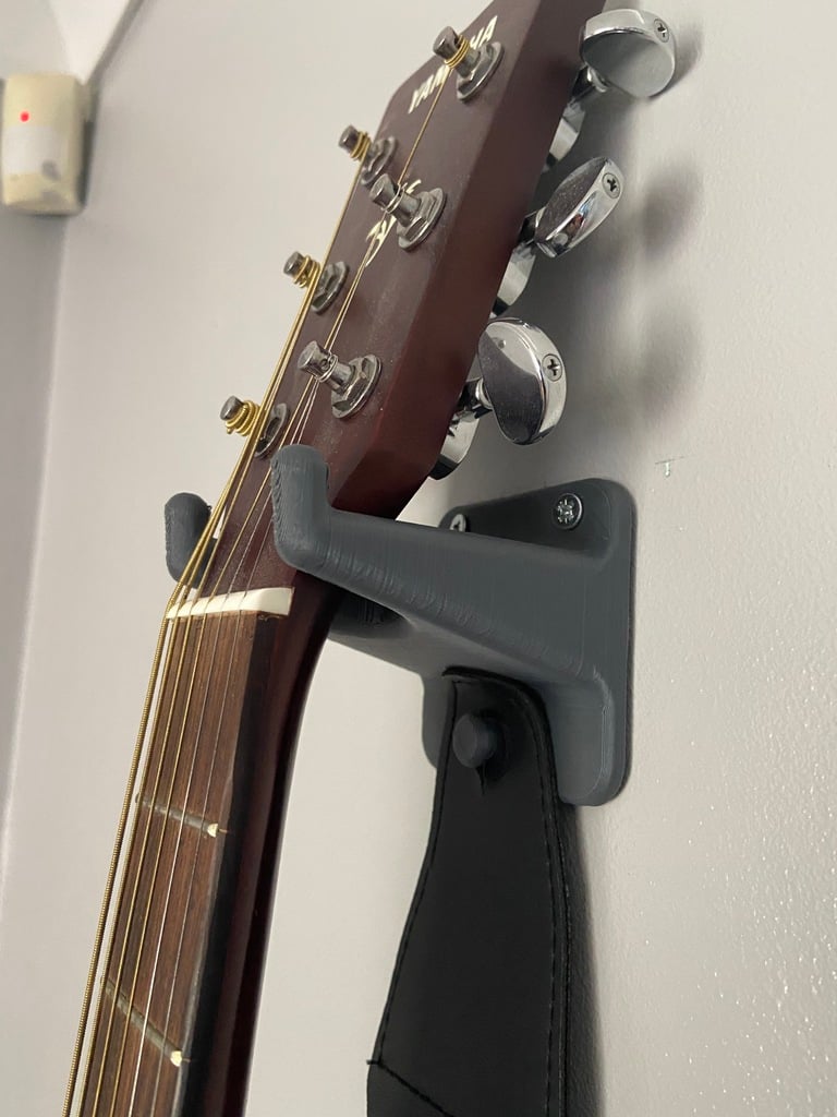 Gitarr Väggfäste med plats för hack och rem