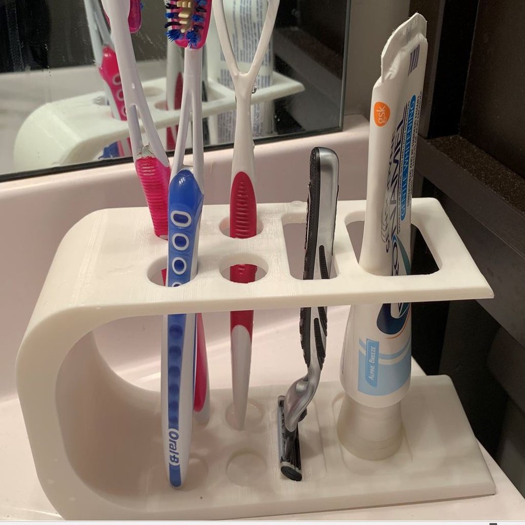 Tandborsthållare med rakhyvelstativ och tandkrämstubhållare
